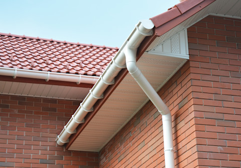 This image shows a close-up of the exterior of a new build house, with a focus on the fascias and soffits.