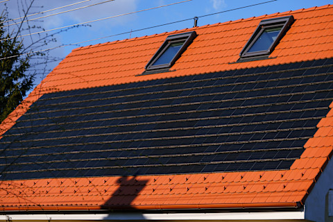 Concrete roof tiles seamlessly integrated with solar panels