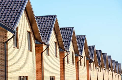 Newly built brick homes in a line on a residential estate