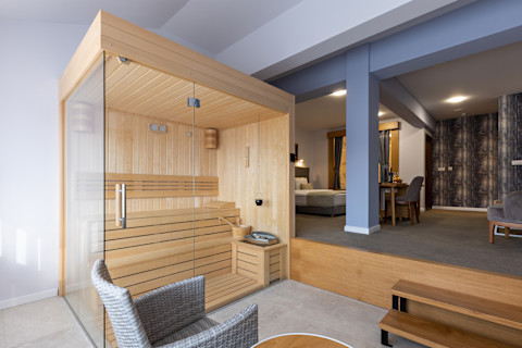 A small wooden sauna in a bedroom