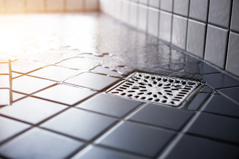 A water drain inside the shower room.