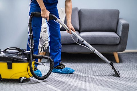 professional-cleaner-vacuums-carpet
