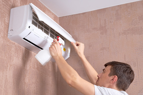 air conditioner cleaning. dirty ac filter. indoors. cleaning and maintenance service concept.