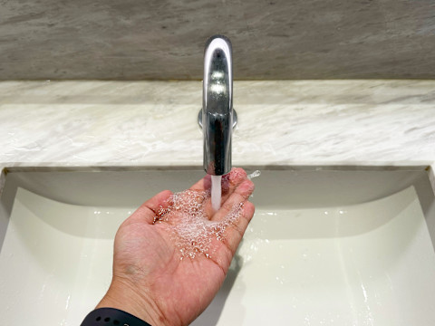 Man washing his hands