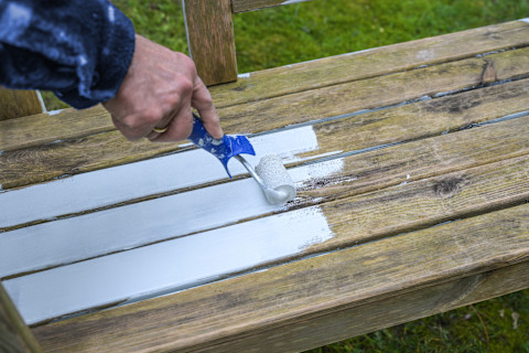 man-painting-bench