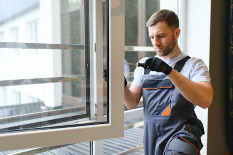 A close-up view of white UPVC sash windows installed in a home, highlighting the design, frame details, and clear glass panes.