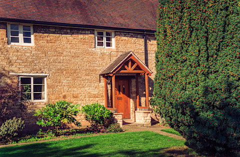 Wooden arched front porch of house
