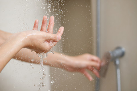 hand-under-shower-water