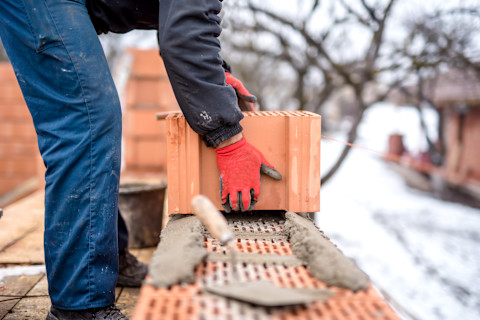 Building brick wall in the snow