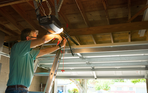 Man installing Garage Light