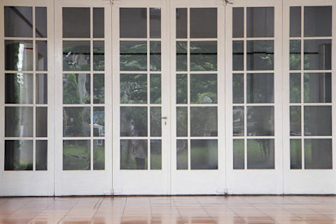 Big white french doors. Interior Columns in Corridor - Backdrop Photo Featuring Architectural Columns.