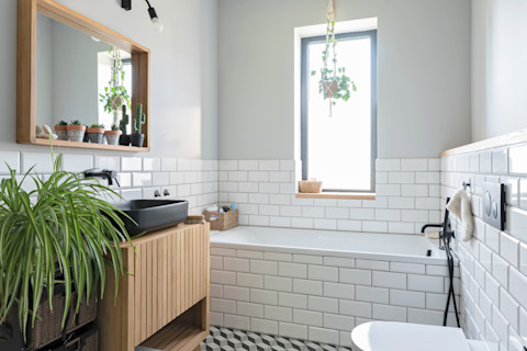 Modern bathroom with Subway wall tiles and patterned floor tiles