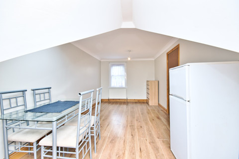 Loft conversion dining room with arch in London UK