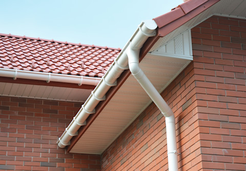 This image shows a close-up of the exterior of a new build house, with a focus on the fascias and soffits.
