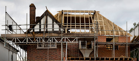 House with scaffolding on the exterior