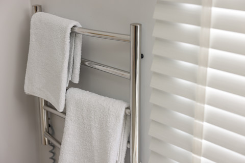 A heated towel rail installed in the bathroom