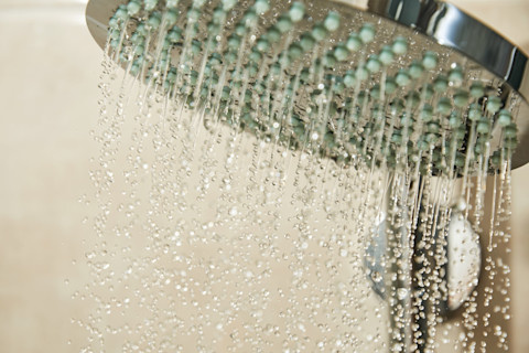 Chrome shower head with running water