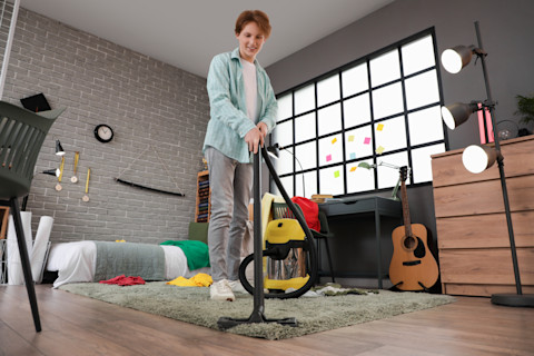 young-man-vacuuming