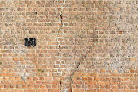 cracked-brick-wall