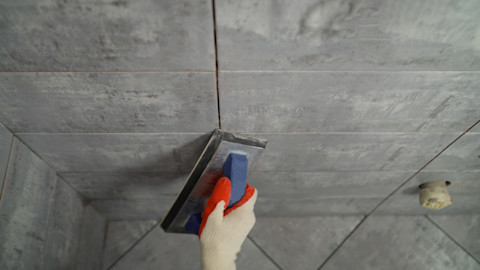 grey-tiles-being-installed