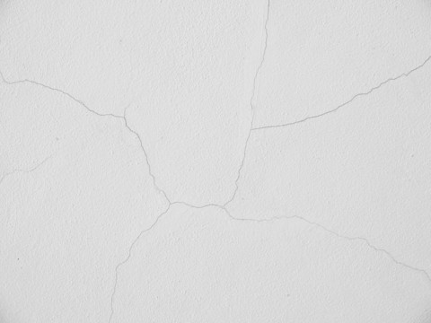 Small crack in white plaster