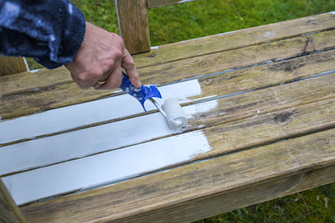 man-painting-bench