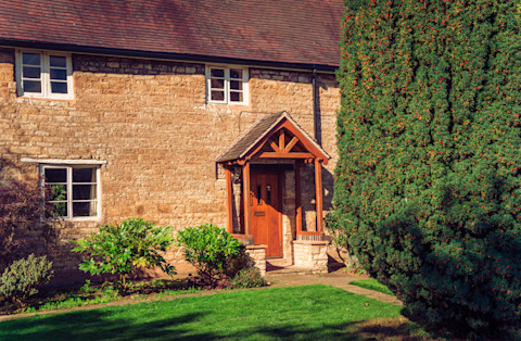 Wooden arched front porch of house