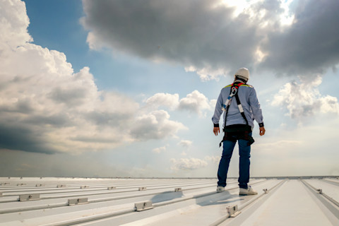 Roofer Working on a Roof  
