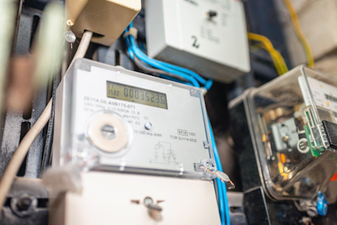 Two smart electric power meter counter measuring power usage.Close-up of modern smart grid residential digital power supply meter.Indoors shot.Selective focus.
