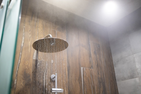 This image shows a modern shower with steam visible.