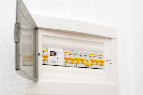 An open fuse box with a fuse tripped
