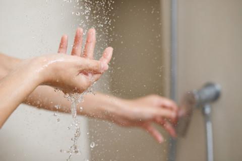 hand-under-shower-water