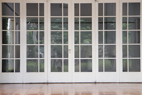Big white french doors. Interior Columns in Corridor - Backdrop Photo Featuring Architectural Columns.