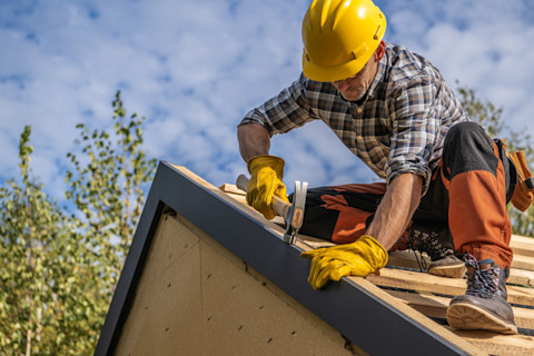 Man building a roof