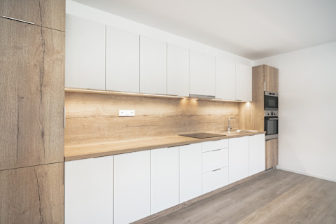A kitchen with under cabinet lighting