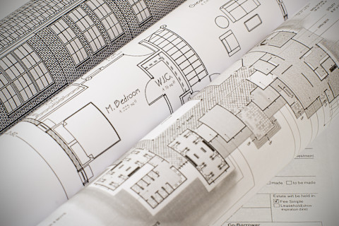 Different building-related plans and papers.
