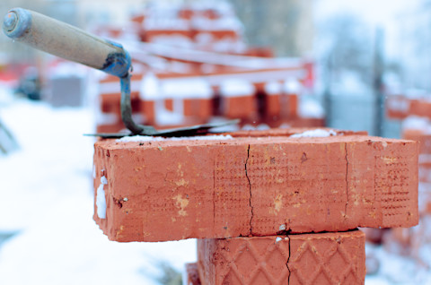 Bricks and trowel in the snow