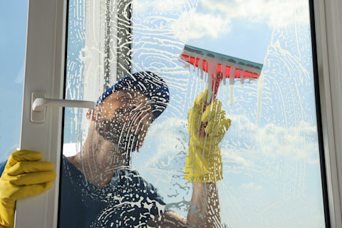 You can see a window being cleaned by a professional.