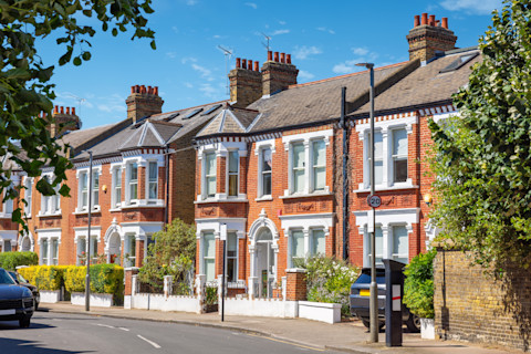 Traditional brick terraced houses and roofs.
