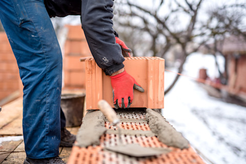 Building brick wall in the snow