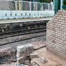 Bricklayer paving concrete kerbs